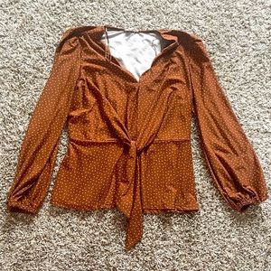 Patterned peplum tie blouse